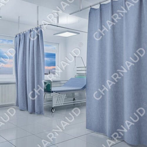 a hospital room with a bed and curtains